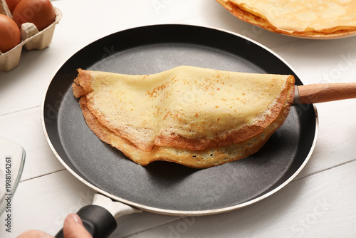 Woman preparing tasty thin ...