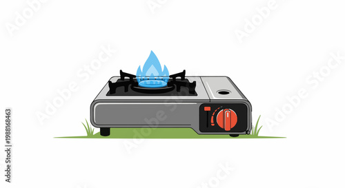 A portable gas stove with a blue flame on a grassy surface