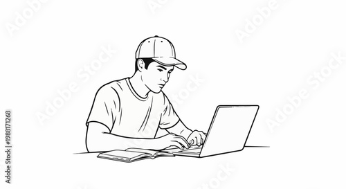 Young man in a cap working on a laptop with a book open