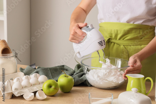 Woman whipping egg albumen ...
