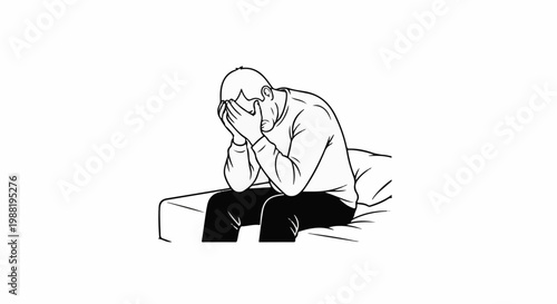 A person sits with their head in their hands, conveying distress and despair