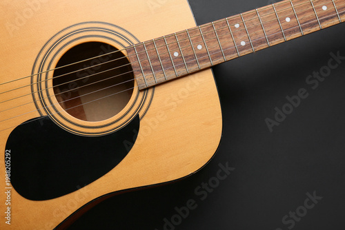 Fotografía Acoustic guitar on black grunge background, closeup