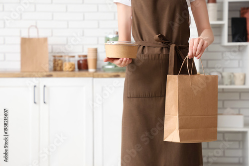 Female barista with paper b...