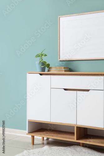 Chest of drawers with books...