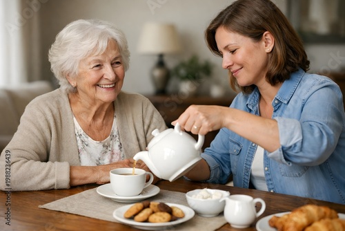 Happy elderly mother and daughter enjoy warm tea and pastries together celebration mothers day