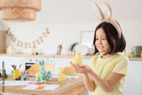 Cute Asian girl with bunny ...