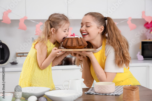 Happy mother and her cute d...