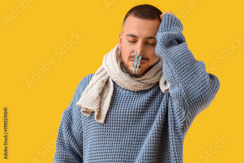Ill young man with clothesp...