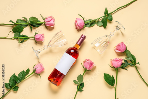 Bottle of pink wine with gl...