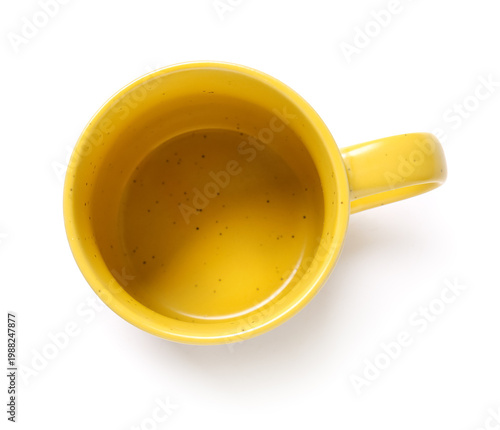 Yellow ceramic cup on white...