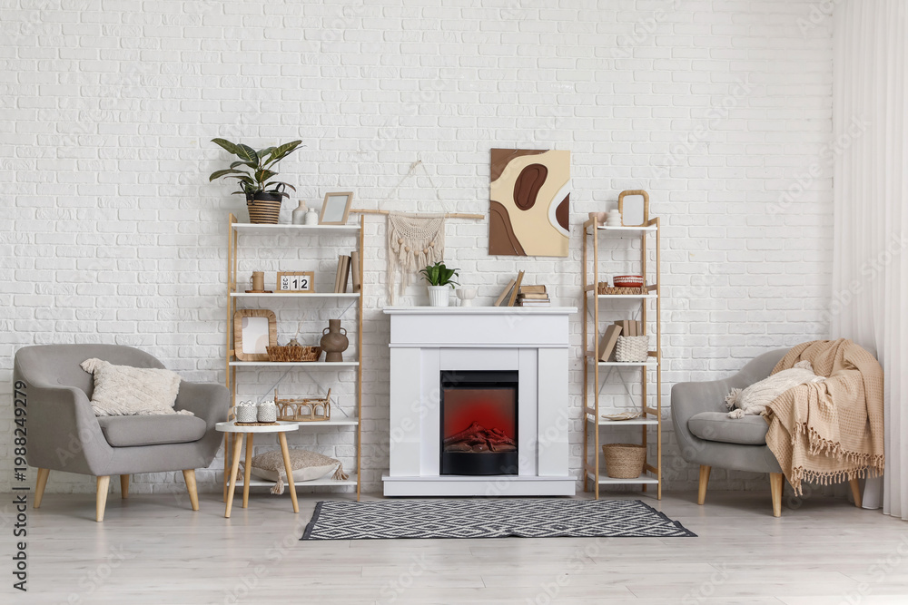Fototapeta premium Interior of modern living room with fireplace, shelving units and armchairs