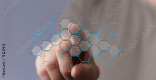 Hand touching digital hexag...