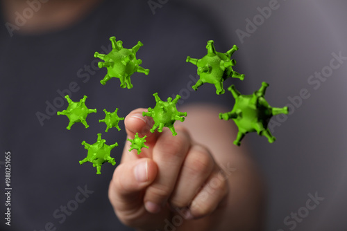 Obraz na plátně A hand touching green virus cells, representing concepts of infectious disease,