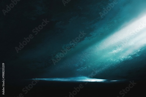 Dramatic blue light rays shining through darkness in abstract scene