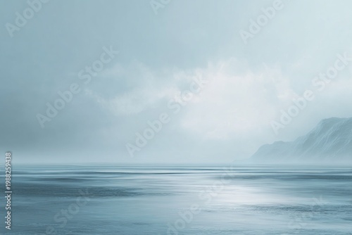 Tranquil seascape with misty mountains and calm waters
