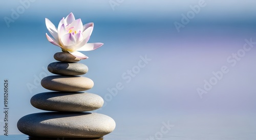 Zen stone stack with lotus blossom a serene composition of balance and nature