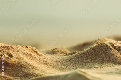 Close-up view of sandy dunes under soft light at the beach