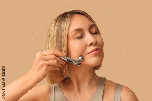 Woman with massage roller o...