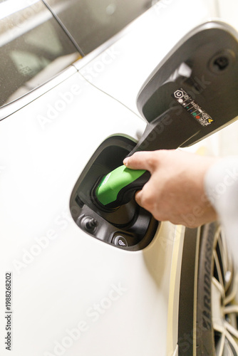 EV charging port being plug...