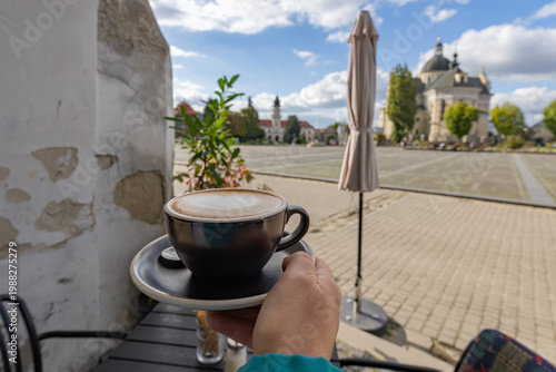 Cuadro en lienzo Cappuccino cup with heart latte art in Zhovkva city square view