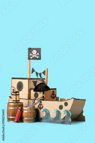 Photos Pirate cardboard ship with explosive on blue background
