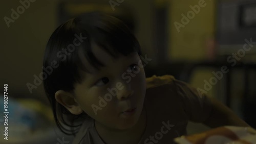 Toddler Eating Grapes Indoors, A sweet video of a toddler happily eating grapes, capturing pure childhood joy and healthy snacking, perfect for family lifestyle documentary and food advertising.