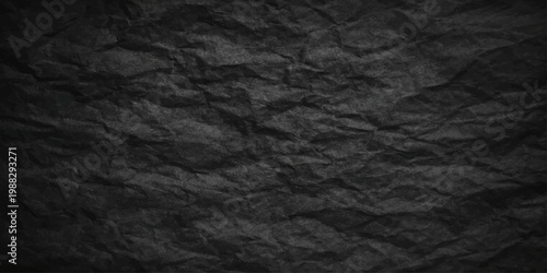 A textured black leather and fabric material surface featuring a crumpled paper design with old grunge patterns and creased brown wrinkled backdrop elements