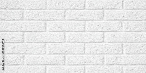 White brick wall texture featuring a solid stone pattern and grey grunge brickwork construction on an old cement building surface background