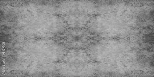 A dark and aged grunge wall background featuring a rough grey concrete texture with a vintage stone pattern and a dirty cement surface for a weathered backdrop design