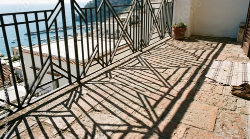 Beautiful Shadows Cast by Railing on a Sunny Terrace