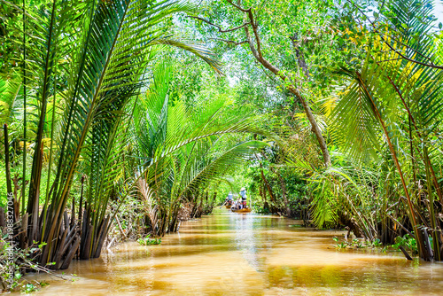 Εκτύπωση καμβά Perspective from a wooden boat on a Mekong delta channel