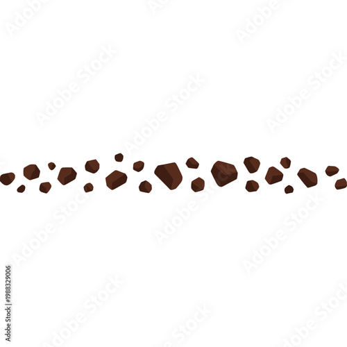 A scenic view of splattered brown liquid droplets on a surface.