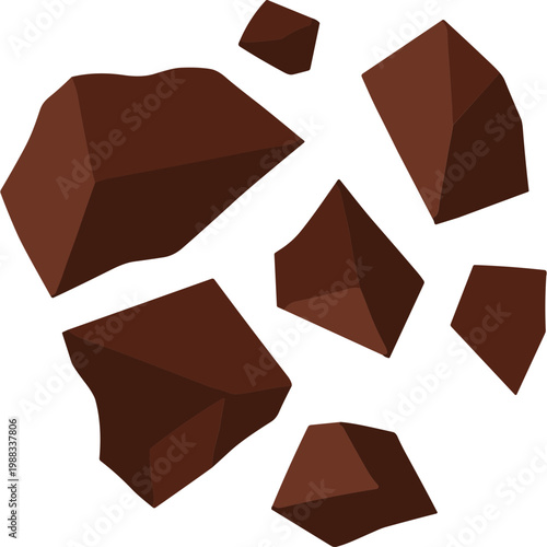 Broken chocolate pieces scattered on a white surface in a messy arrangement