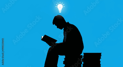 Silhouette of a person reading with a glowing lightbulb indicating creative inspiration