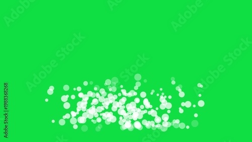 White bokeh circles and floating particles animation, isolated on green screen background
