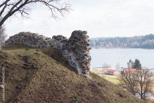 Fragment of the ruins of a medieval crusader castle on top of a  mountain. Defensive fortress architecture overlooking the countryside.
