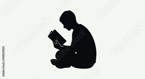Silhouette of Child Reading a Book in Quiet Focus