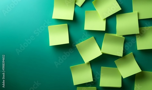 Scattered Yellow Sticky Notes on Teal Background - Creative Workspace Concept