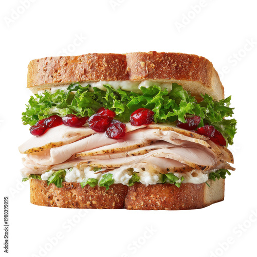 Fresh turkey sandwich with lettuce and cranberry sauce on whole grain bread prepared in a kitchen setting during daytime on transparent background