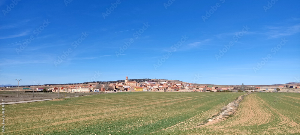 Fototapeta premium Celadas rural village green fields Sierra Palomera valley Teruel Spain