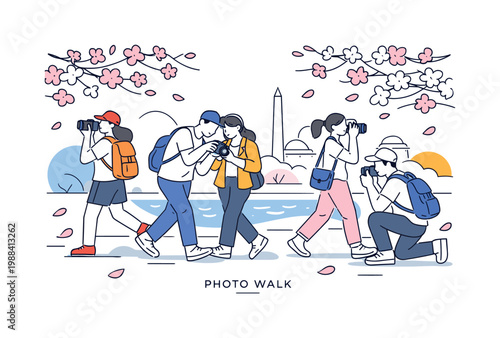DC blossom photo walk. Groups of people walking with cameras under cherry blossom trees near the water,