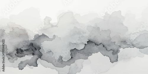 A vintage light filters through the gray atmosphere and fluffy white cumulus clouds over a misty nature landscape of snow covered mountains under a dreamy summer sky