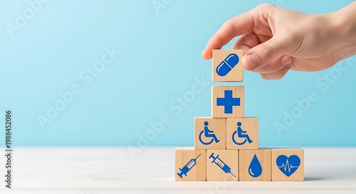 Medical healthcare icons on wooden blocks, hand stacking medicine cubes in pyramid, health insurance and pharmacy concept on blue background