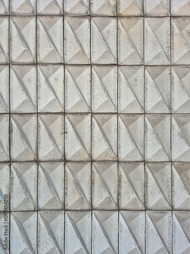 Grey geometric 3D relief wall tiles texture background