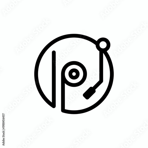 The vinyl record player spins on a turntable outdoors.