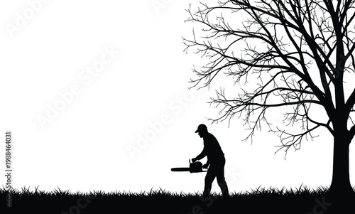 Black silhouette of a professional lumberjack using a chainsaw to trim a large bare tree in a grassy field for forestry landscaping and tree removal services concepts