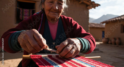 Elderly Quechua Woman's Skilled Hands Weaving Vibrant Alpaca Wool on Traditional Loom in Andean Village Courtyard