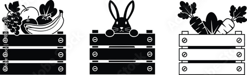 Set of black and white icons featuring wooden crates filled with fresh organic fruit vegetables and a cute rabbit for farmers market agriculture and harvest festival concepts