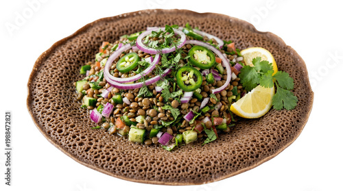 Lentil salad with onions, chili, and herbs served on rustic flatbread over white background
