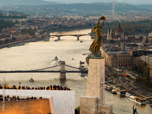 Renovated Liberty Statue, Szabadság Szobor, Citadella visitor center and Hungarian flag on Gellért Hill in Budapest, Hungary.